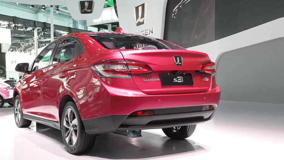 Rear view of sedan highlighting taillights and alloy wheels