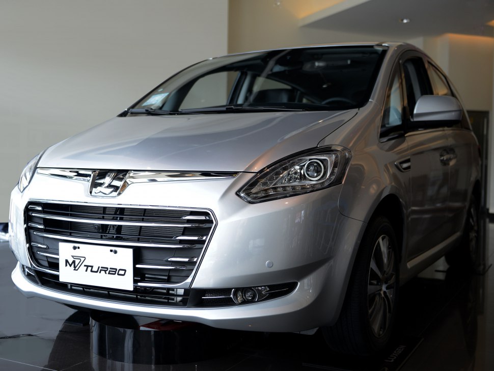Angled front view featuring prominent grille and headlights