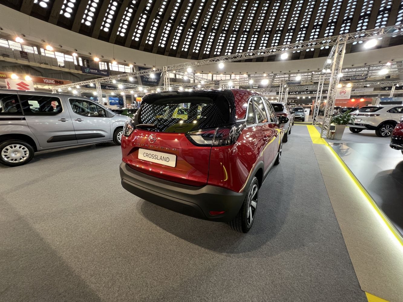 Red compact SUV rear with distinctive taillights and black roof