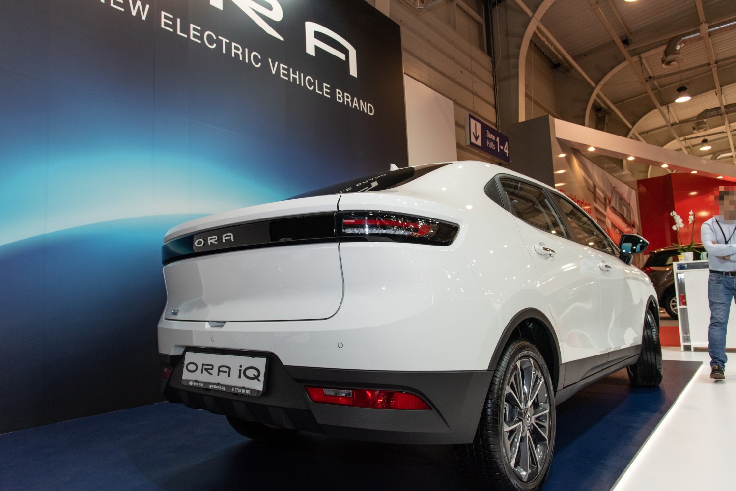 Rear of white electric SUV with modern taillights and sleek bumper
