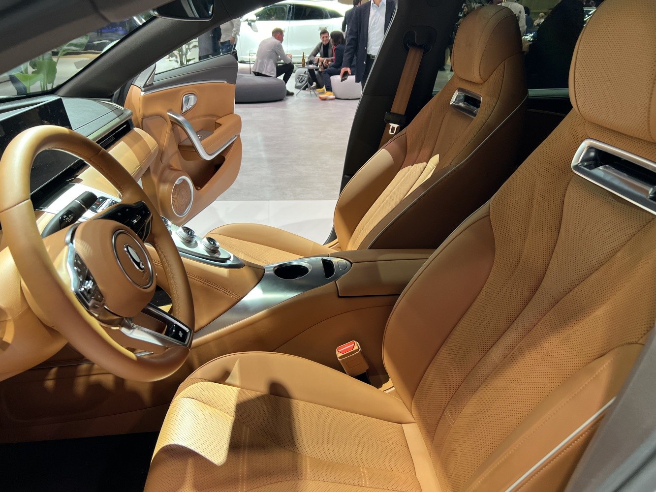 Tan leather seats and modern dashboard with digital displays