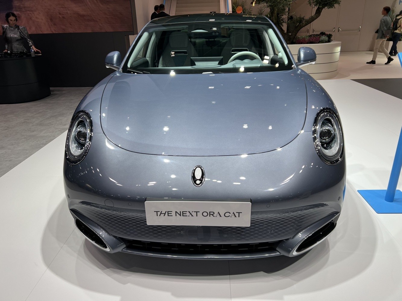 Front view with round LED headlights and minimalist grille