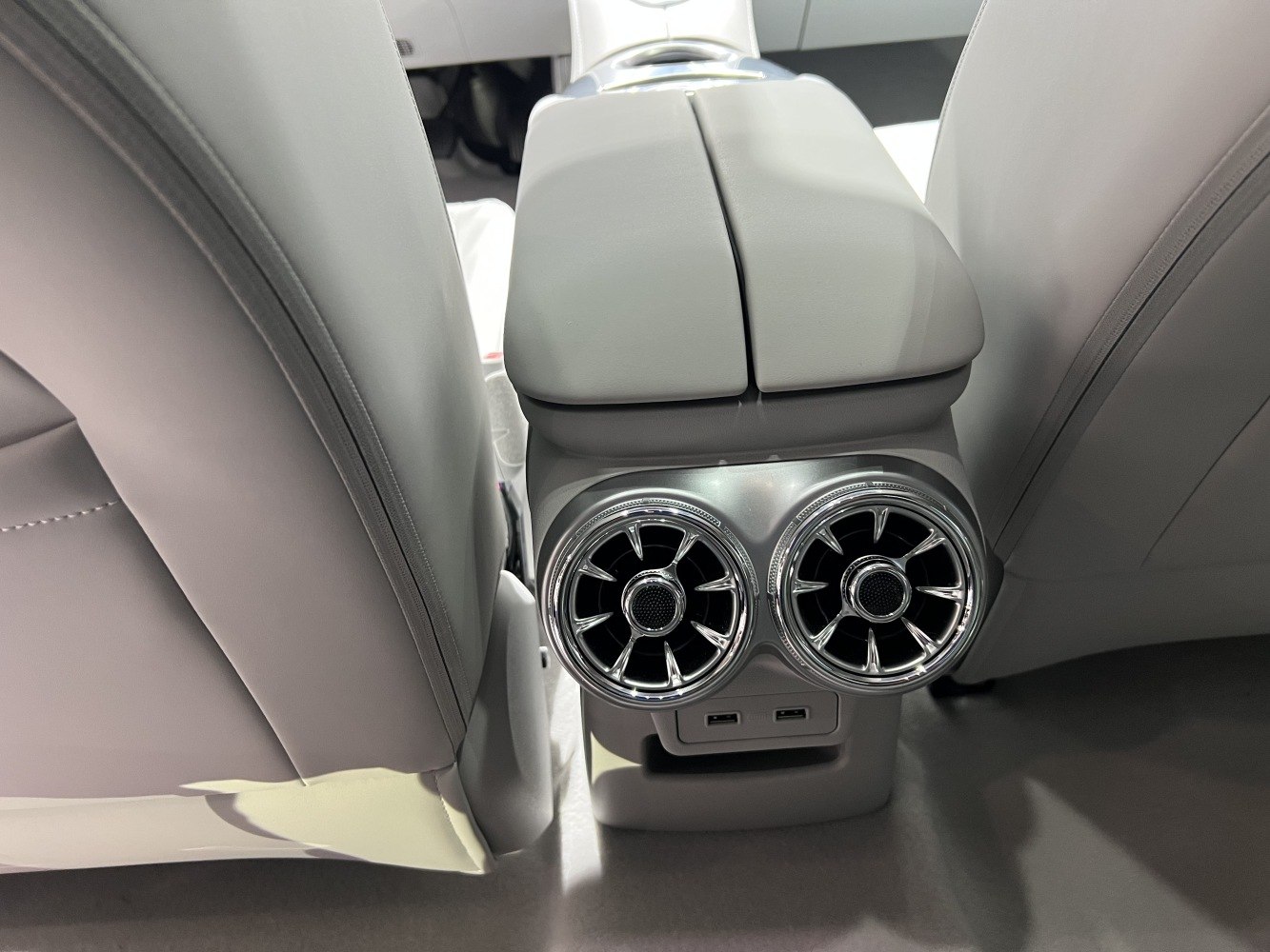 Rear center console air vents and dual USB ports.