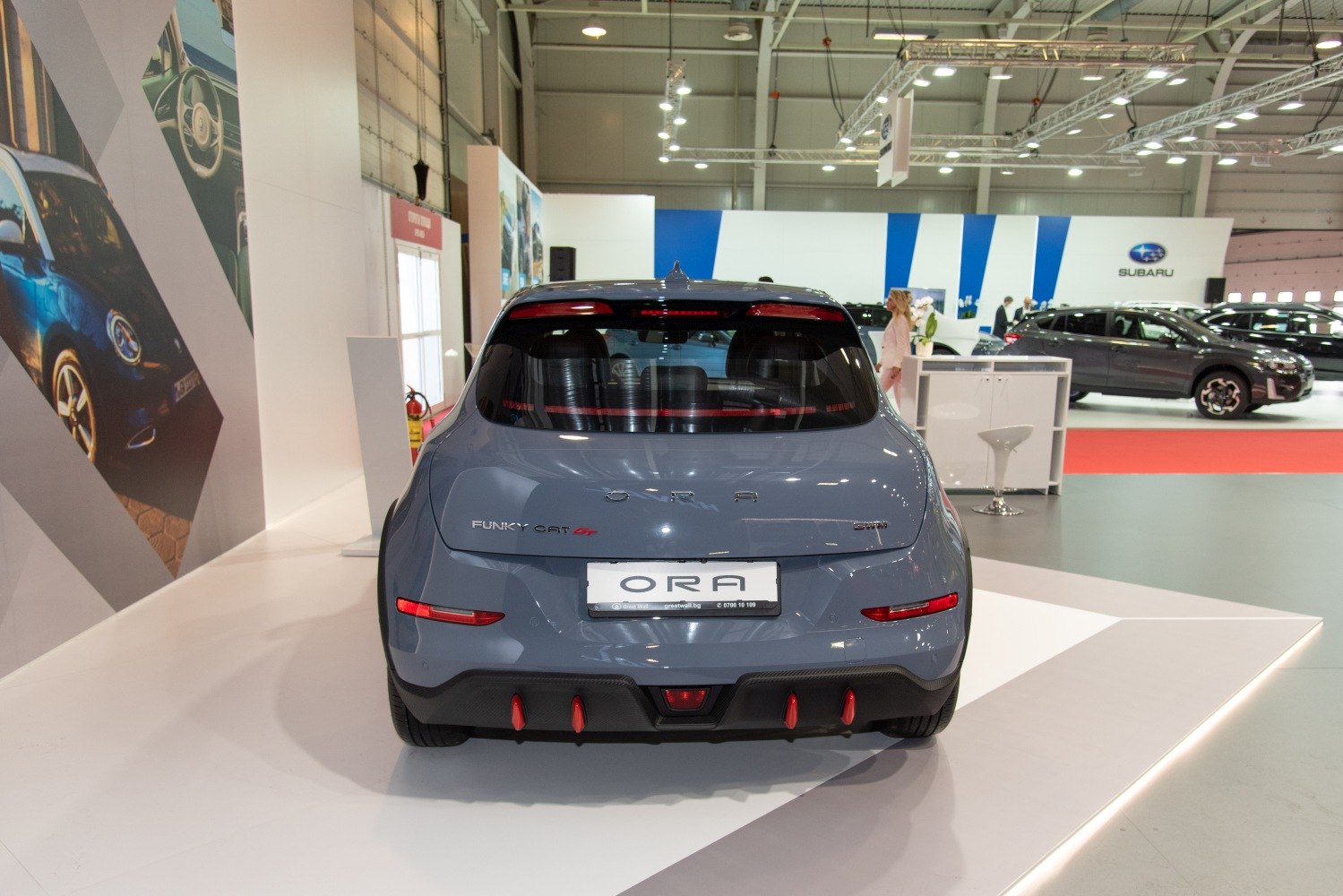Rear view of compact hatchback with distinctive taillights and diffuser