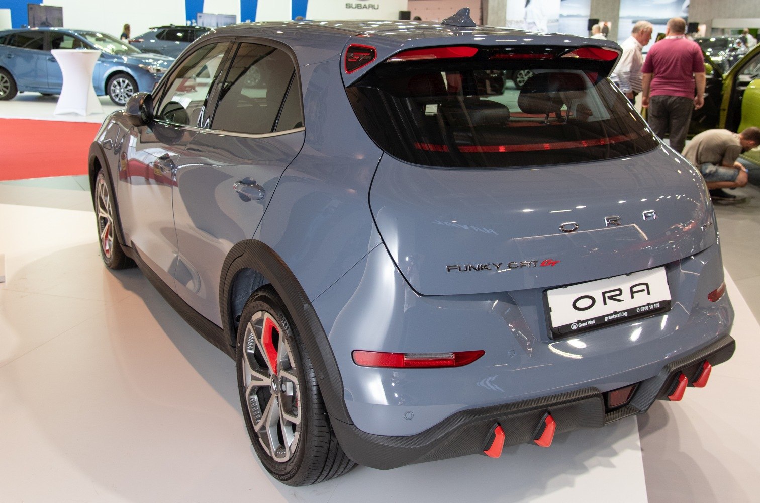 Rear view with sporty diffuser, high rear spoiler and red accents