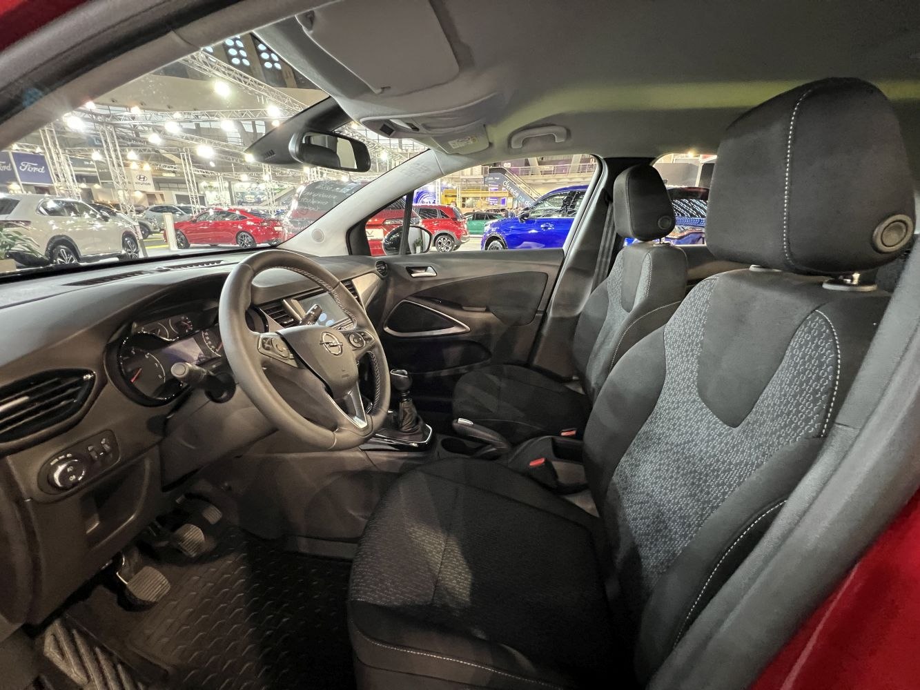 Modern front interior with steering wheel and seats