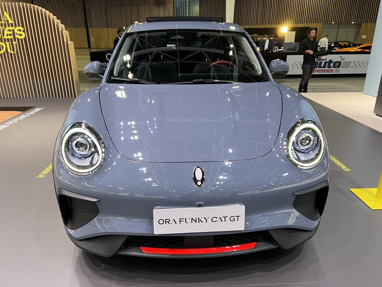 Front view with round LED headlights and aerodynamic bumper