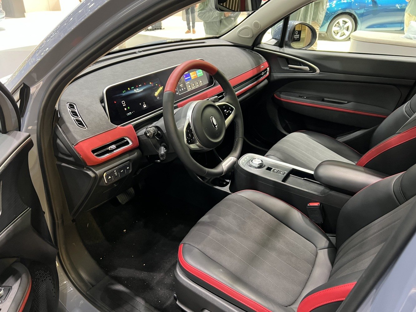 Digital dashboard and sporty black-red interior seating