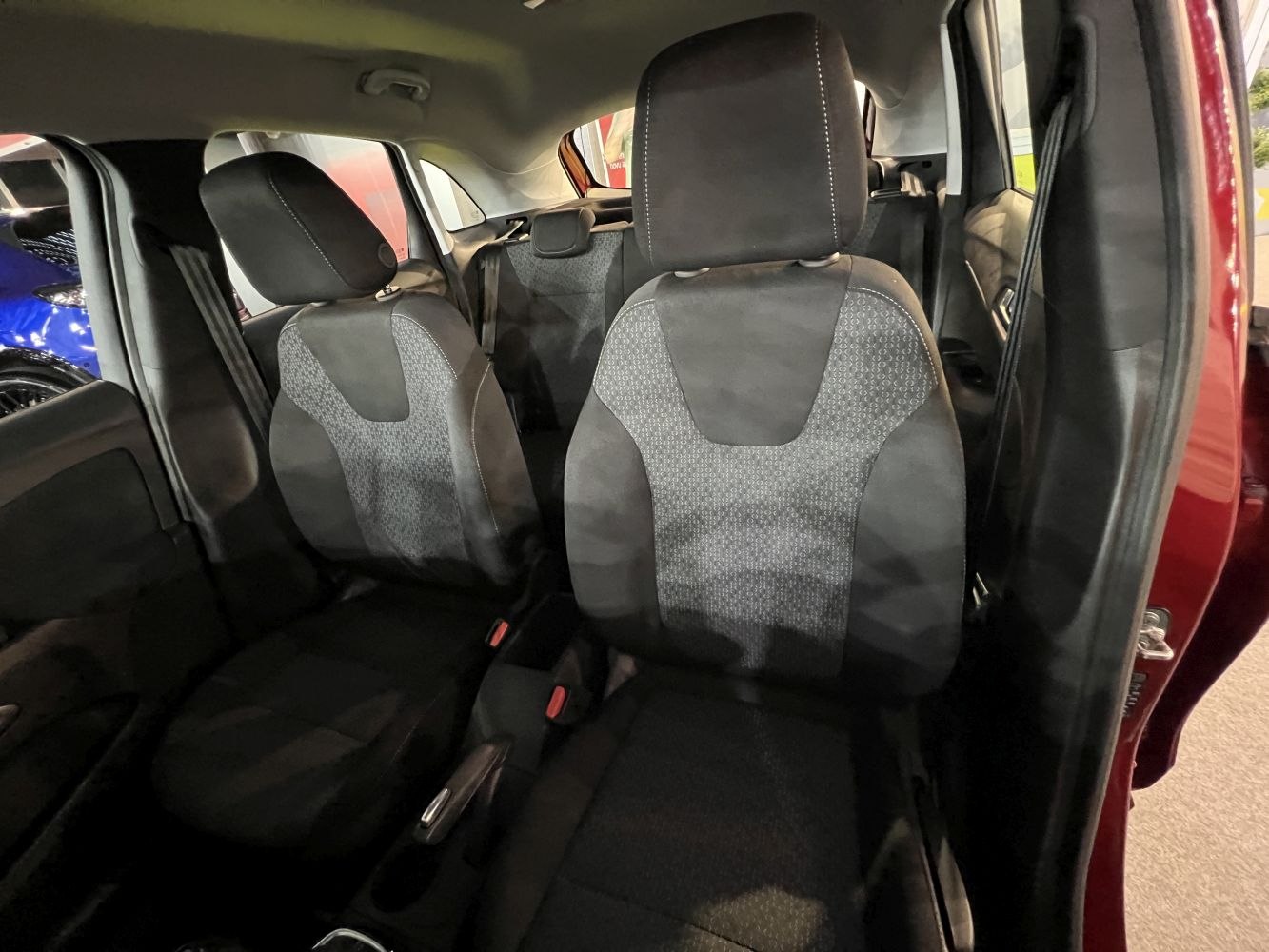Upholstered front seats with patterned fabric and headrests