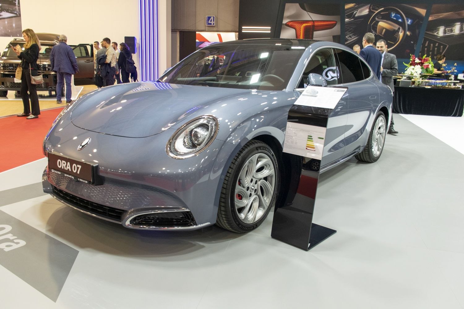 Front view with round headlights and modern alloy wheels