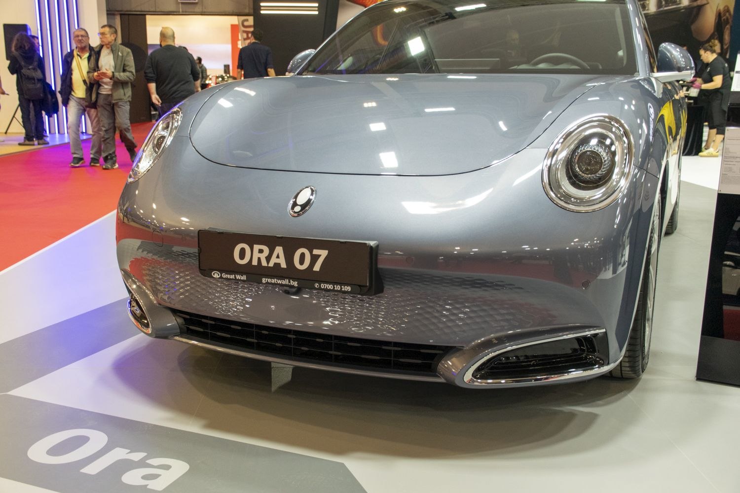 Front view with round headlights and smooth bumper design