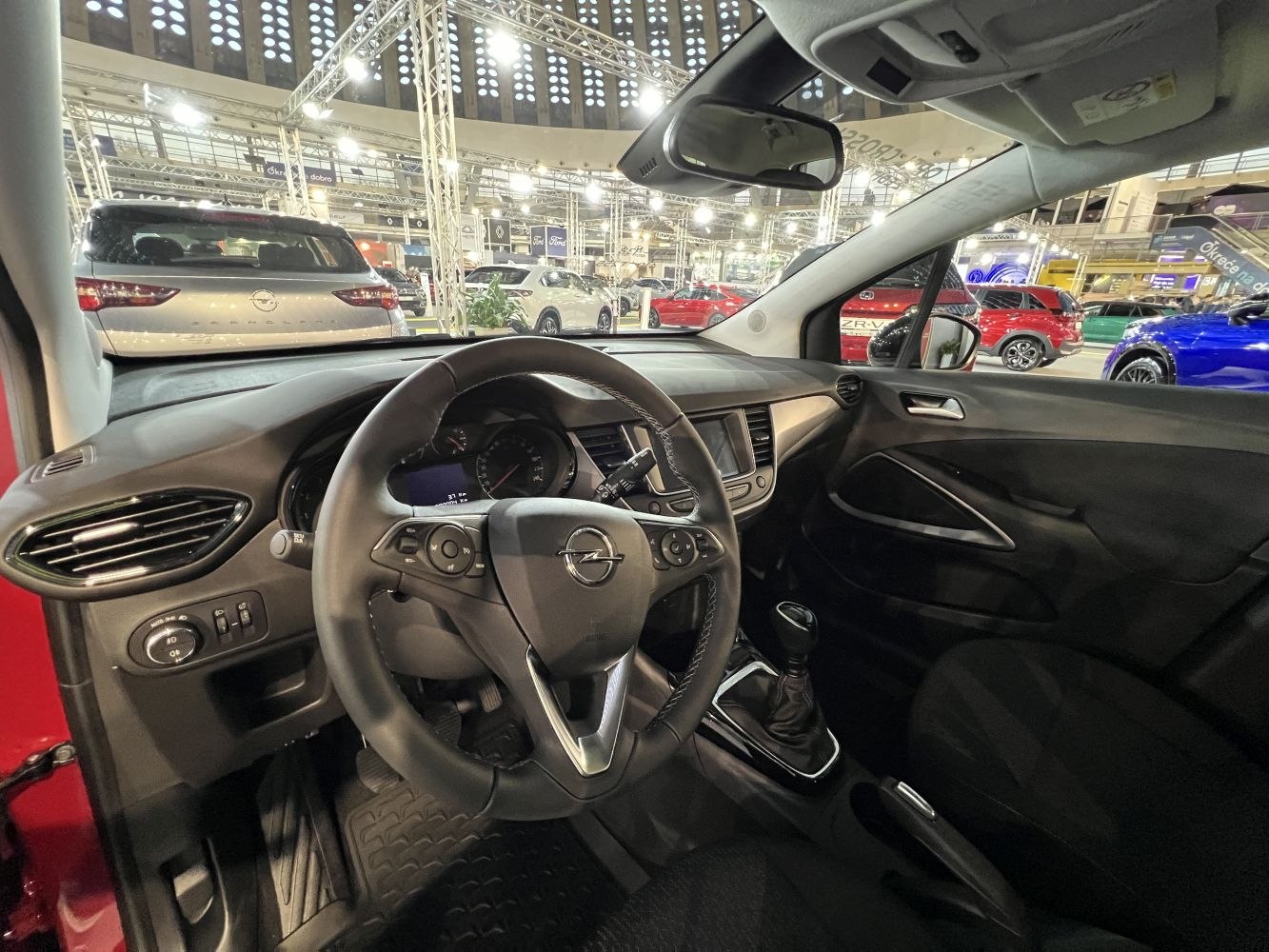 Steering wheel, dashboard, manual gear shifter in car interior