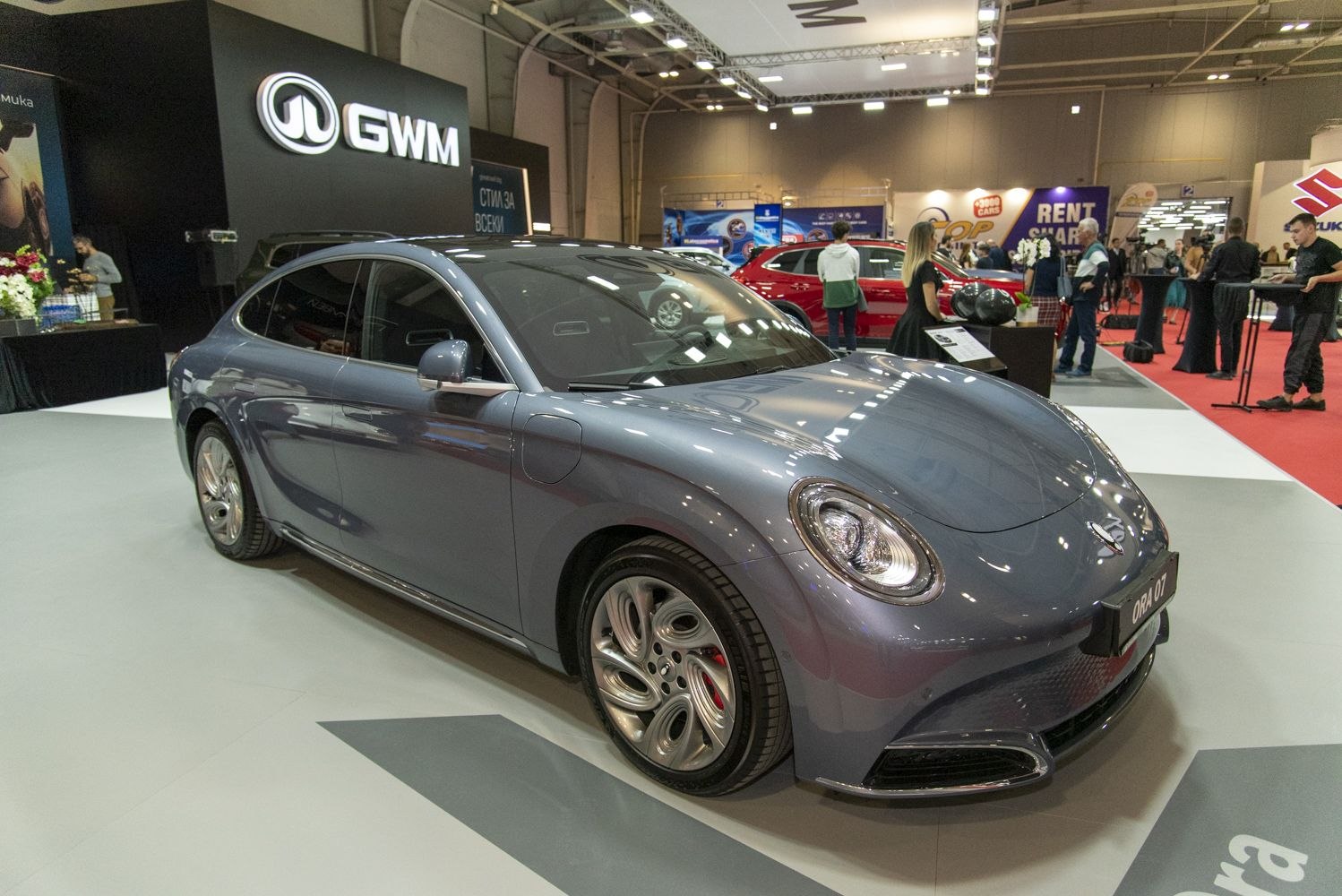 Electric sedan with rounded headlights and aerodynamic smooth contours