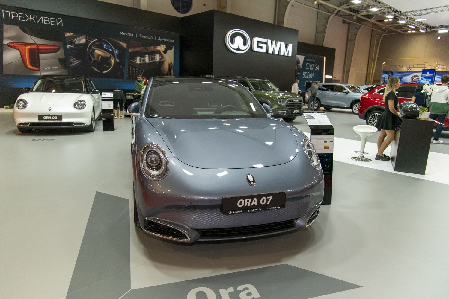 Sleek front view with distinctive round headlights and modern front grille