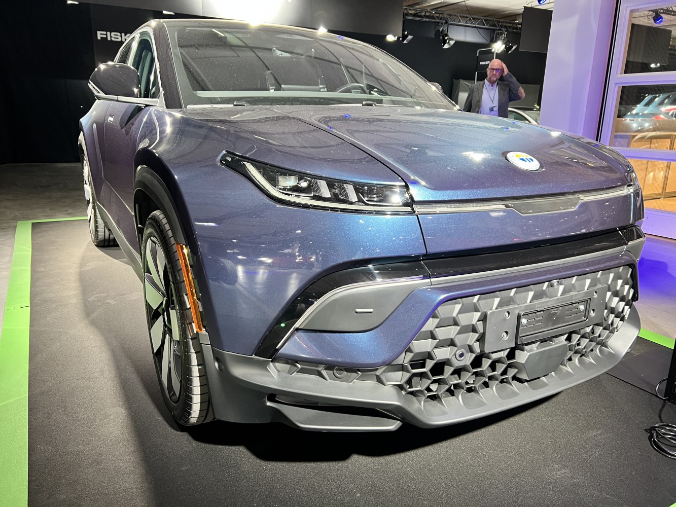 Front view of SUV with LED headlights and geometric grille