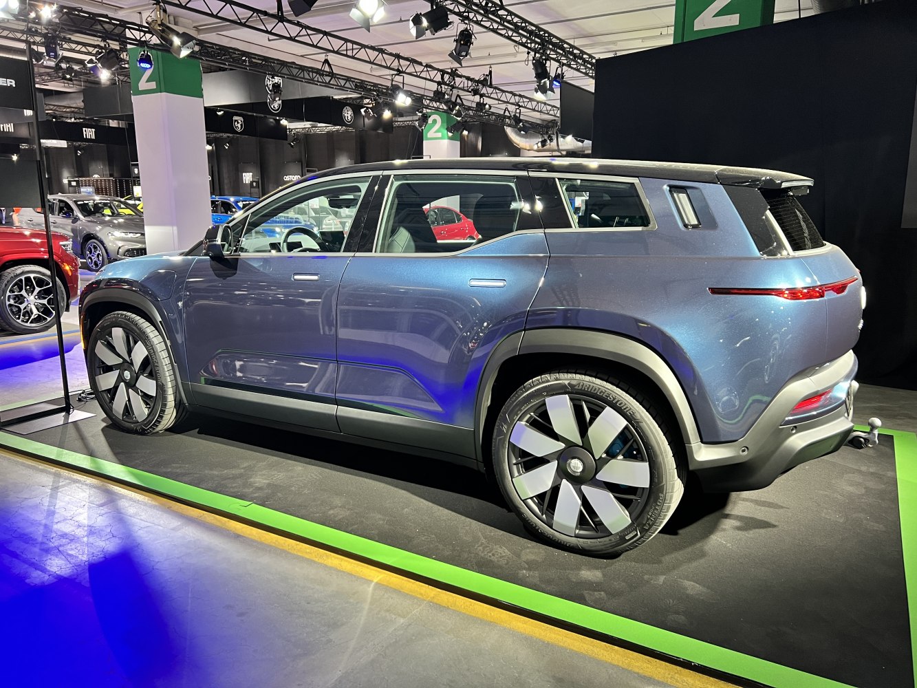 Side view of SUV with unique rear LED light strip and distinctive wheels