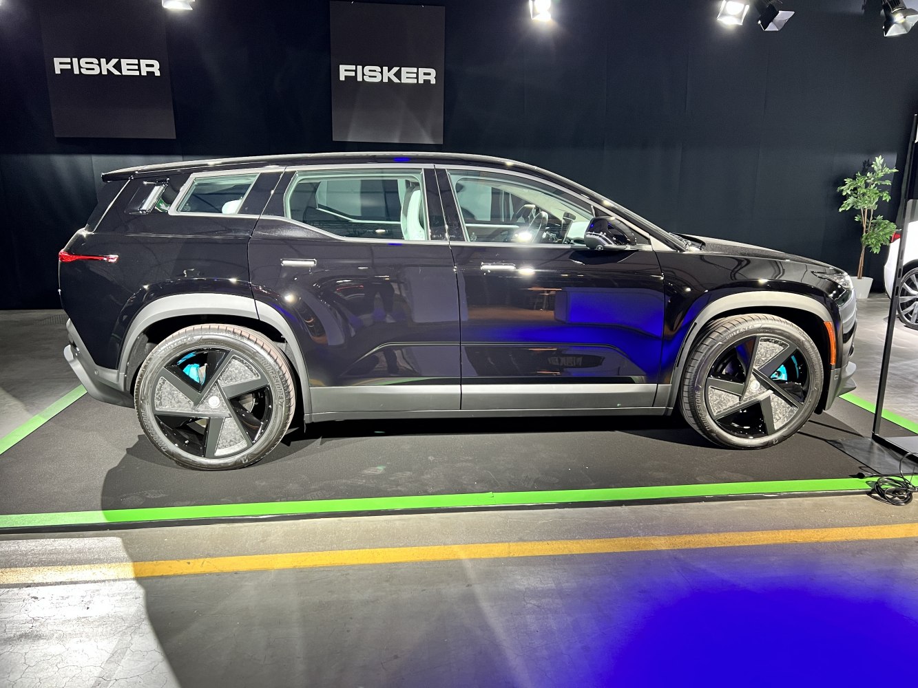 Sleek electric SUV side profile with distinctive wheel design