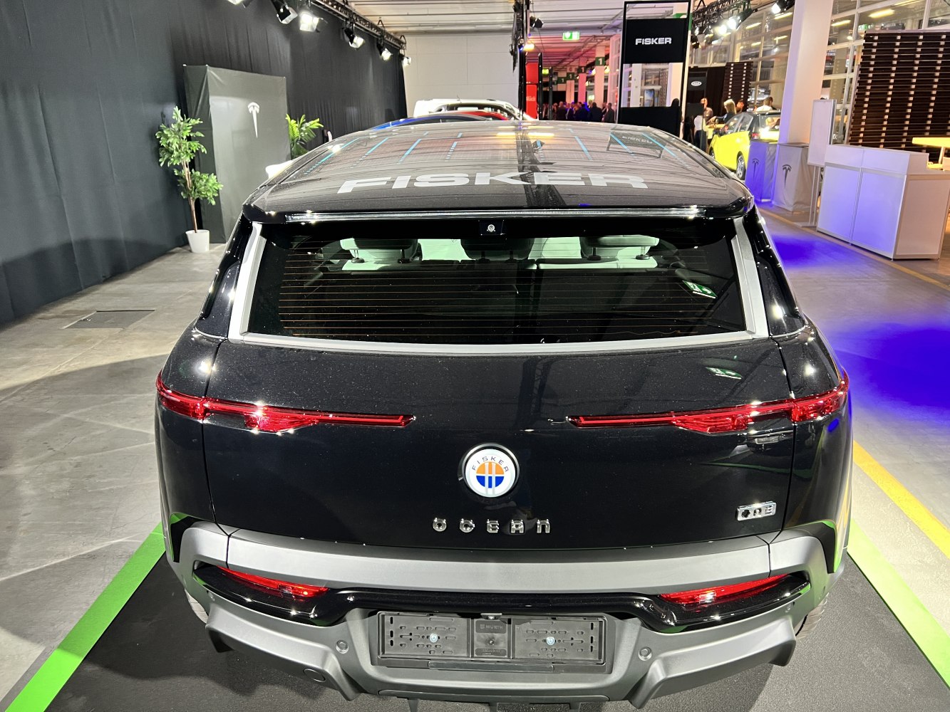 Rear view showcasing taillights and solar panel roof