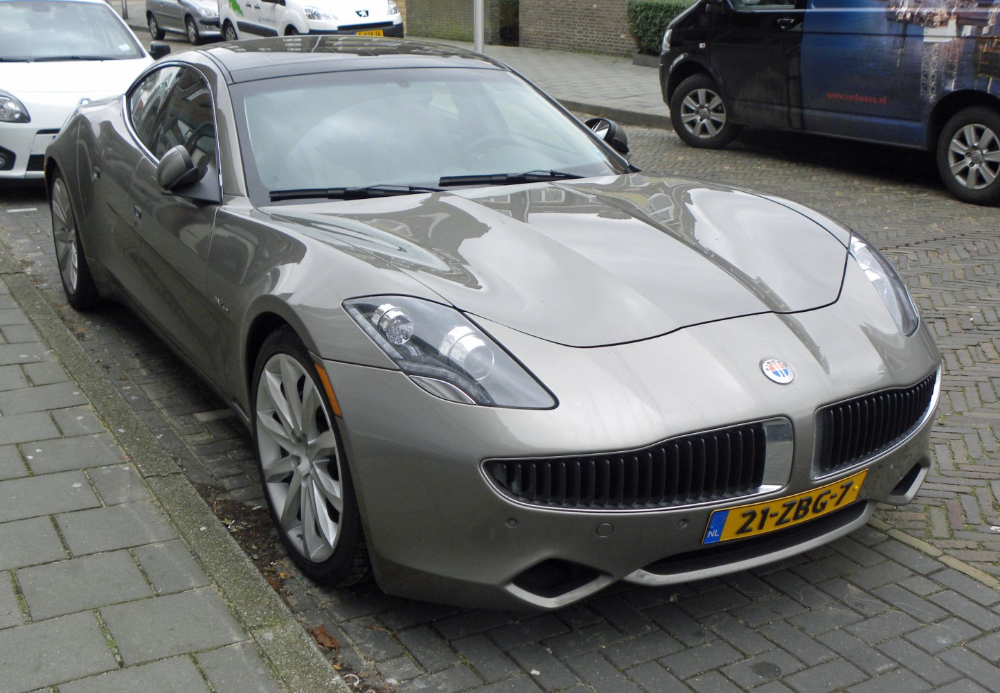 Aerodynamic front view of a luxury hybrid coupe with unique grille and sleek headlights