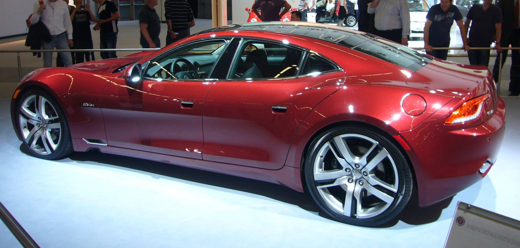 Side profile of sleek luxury sedan with large alloy wheels