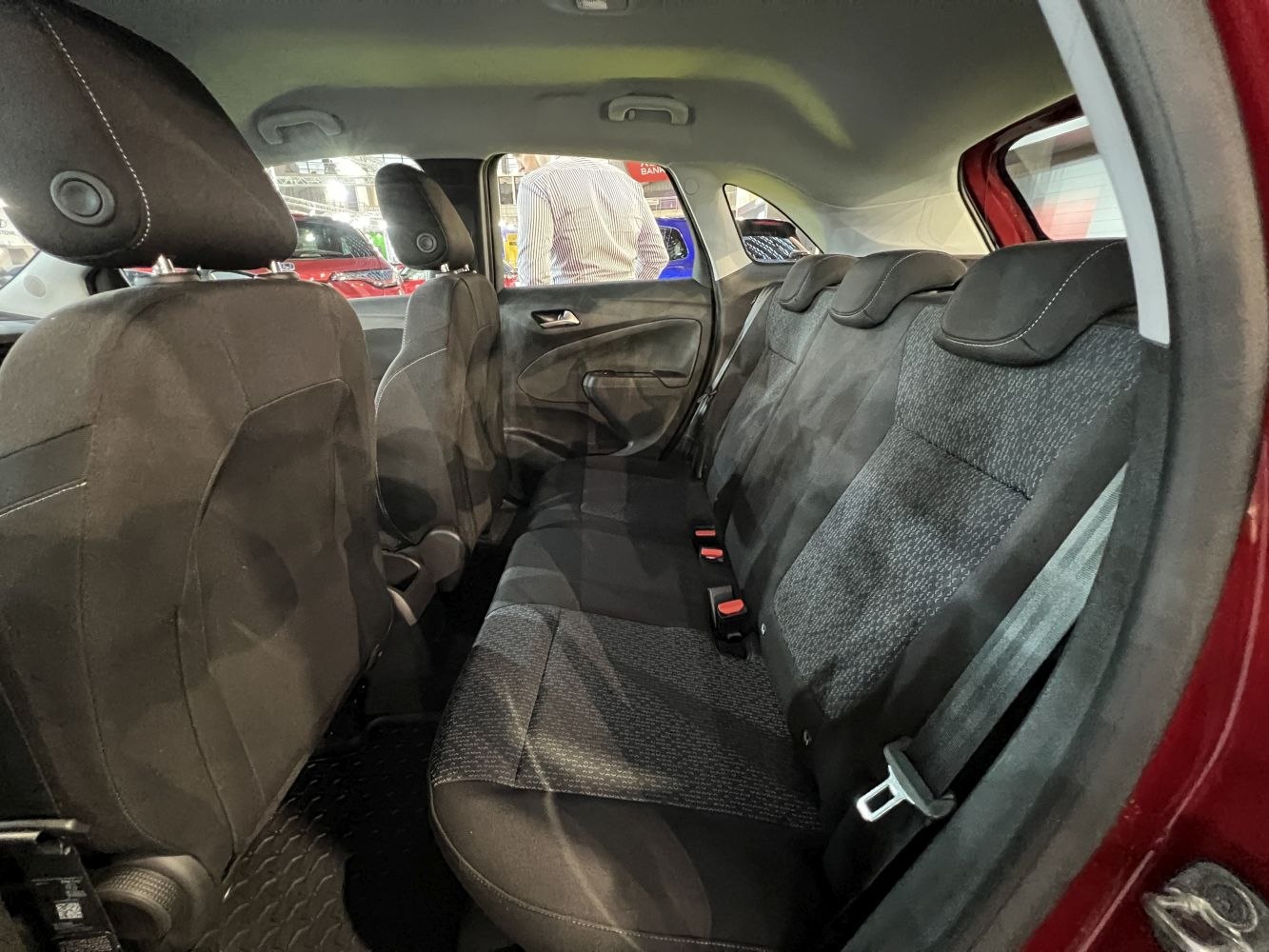 Rear interior seating with fabric upholstery and headrests