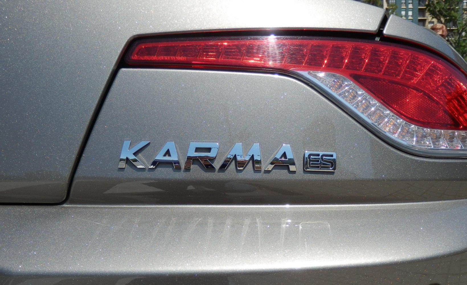 Rear badge and tail light close-up on a silver vehicle