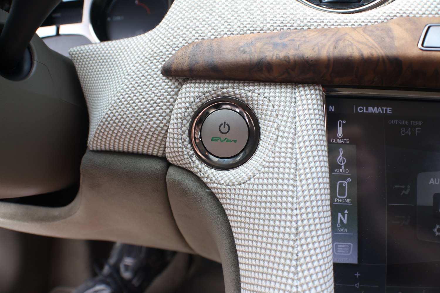 EV power start button and climate control panel with wood trim