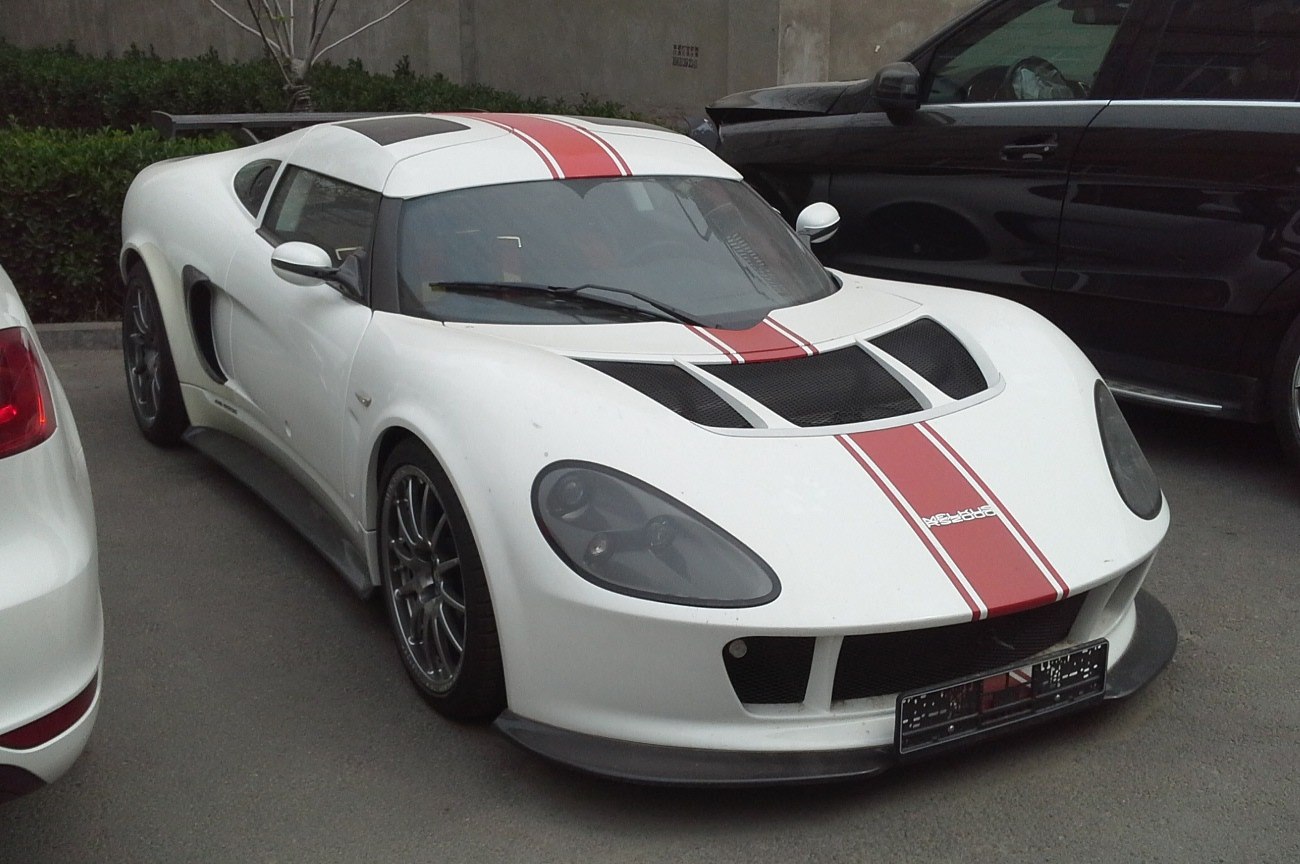 White sporty coupe with red racing stripes and mesh hood vents.