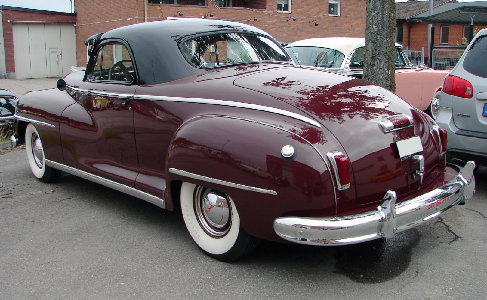 Classic coupe rear view with chrome bumper and whitewall tires
