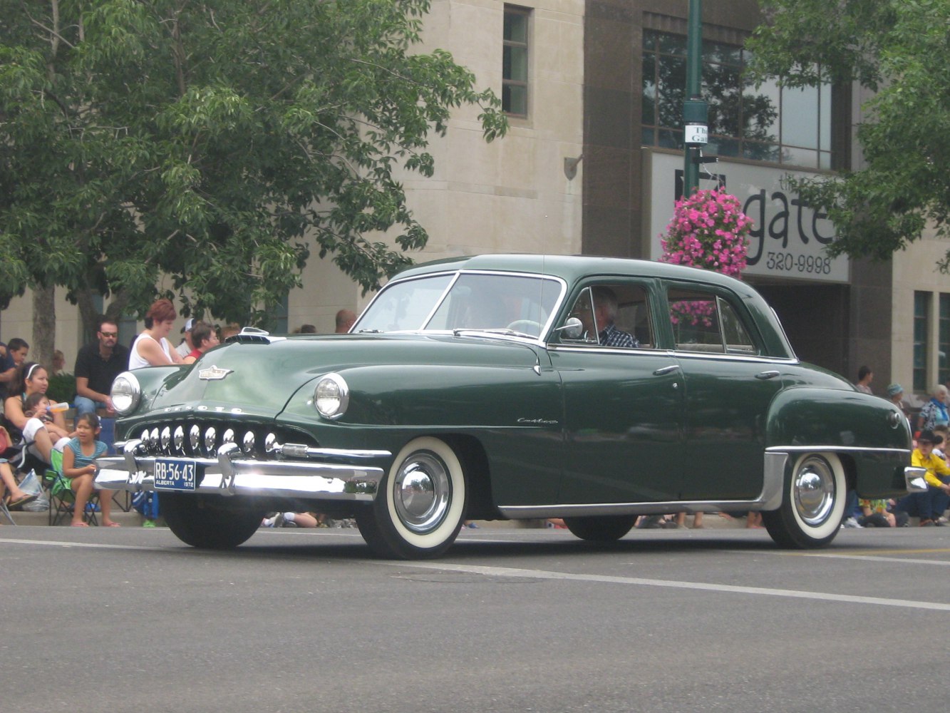 Vintage sedan with chrome grille and whitewall tires