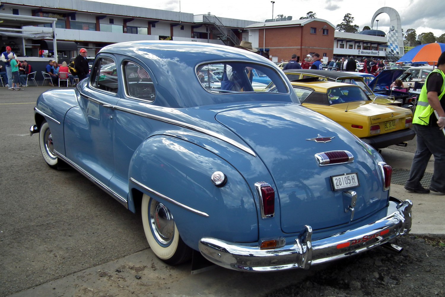 Vintage rear view of classic coupe with whitewall tires and chrome detailing