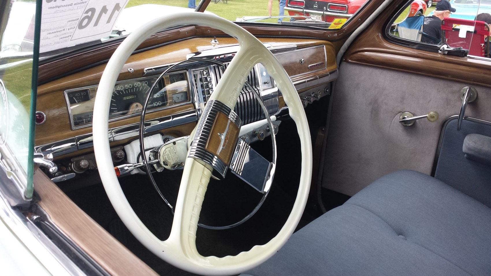Vintage steering wheel and wooden dashboard of classic car interior