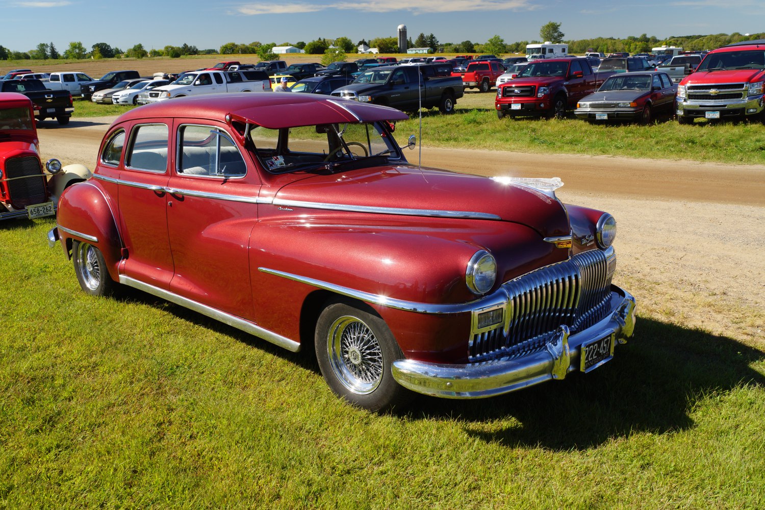 Rounded body, chrome grille, 4-door vintage sedan