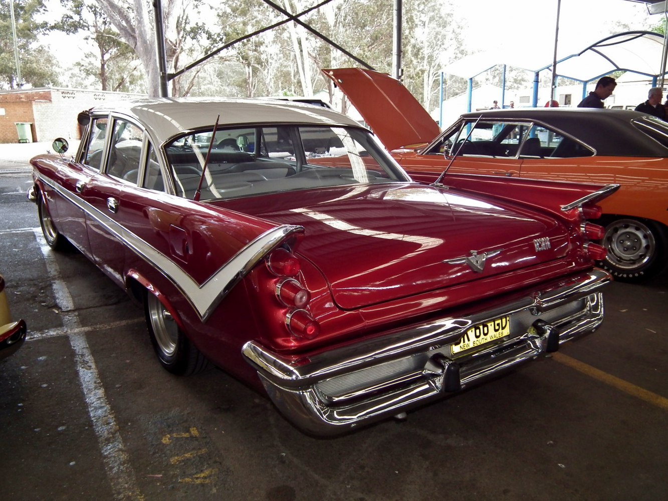 Classic sedan rear featuring fins and stacked tail lights.