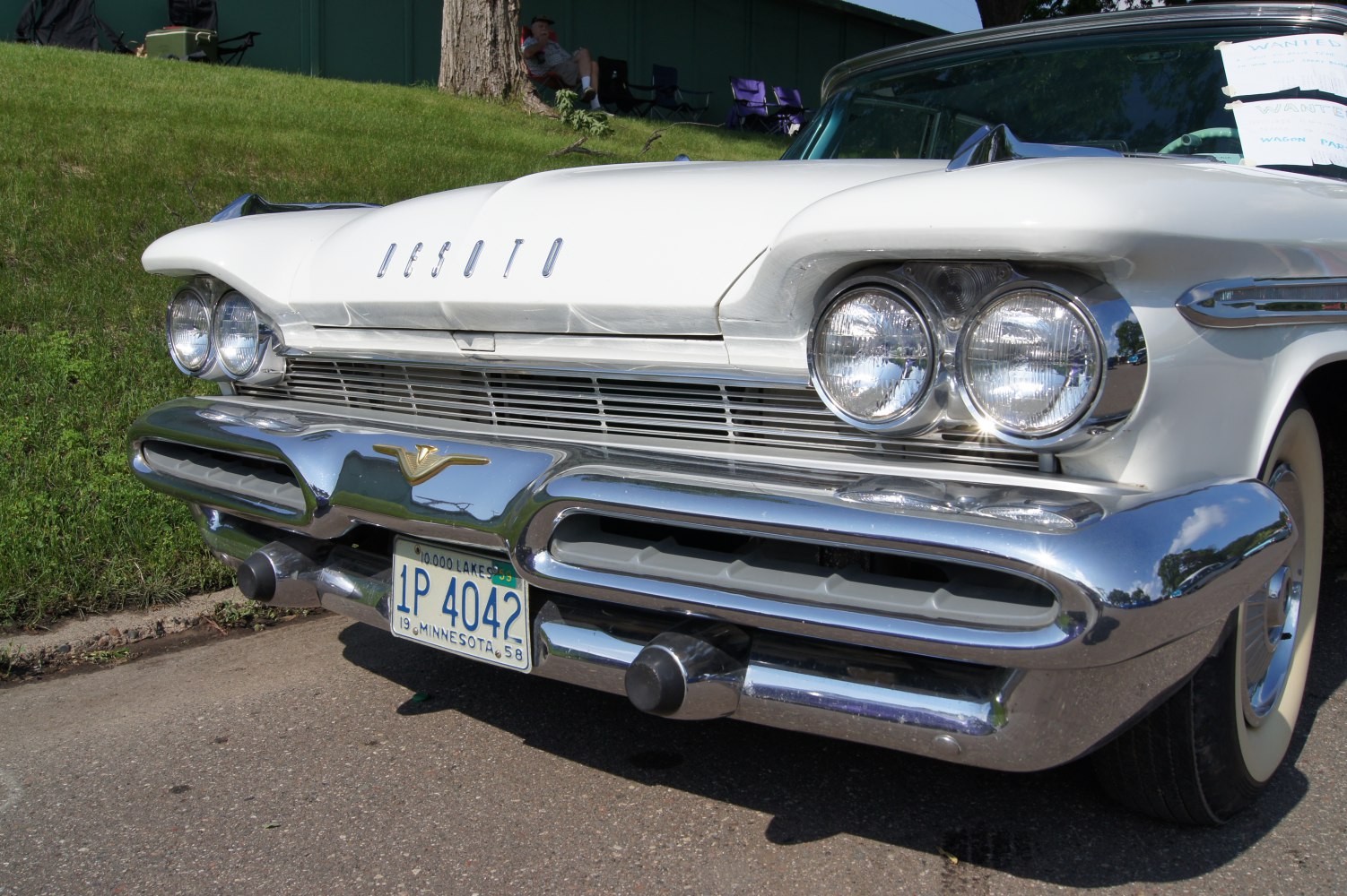 Front grille with dual round headlights and chrome bumper.