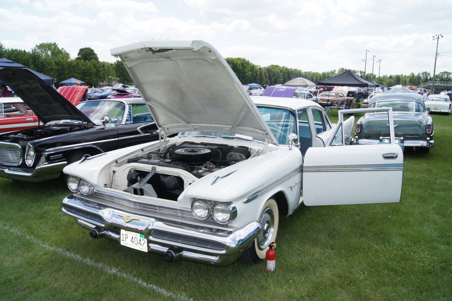 Classic 1959 sedan front with open hood and chrome details