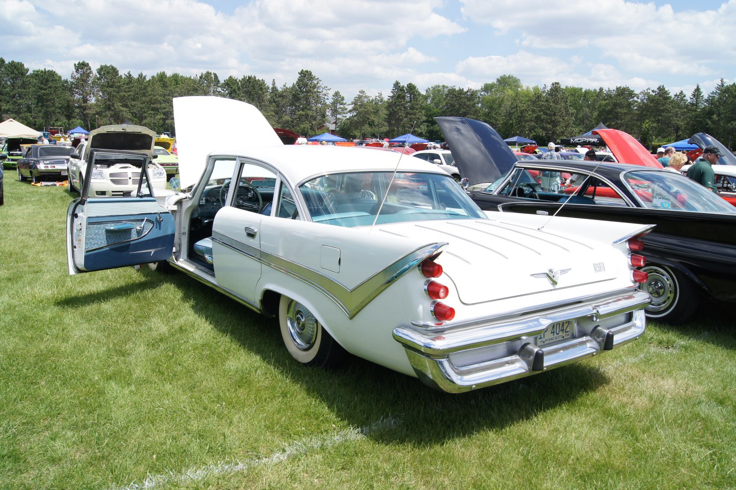 Vintage sedan with triple tail lights and iconic tail fins