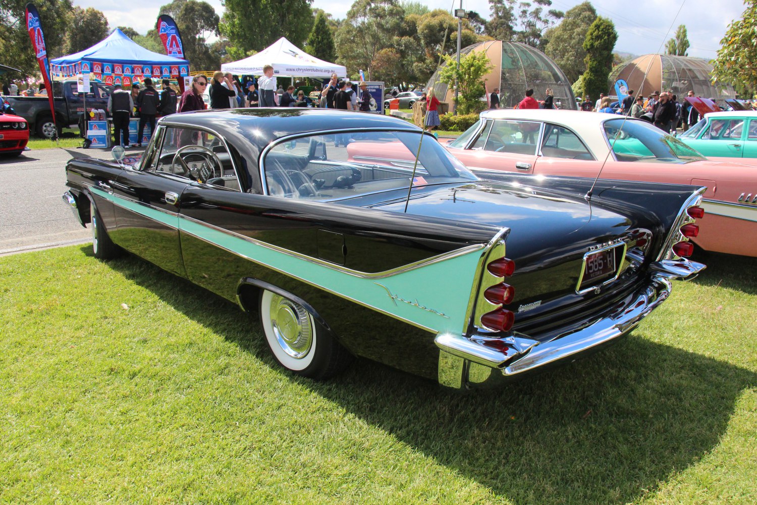 Two-door coupe with prominent tailfin and triple bullet tail lights