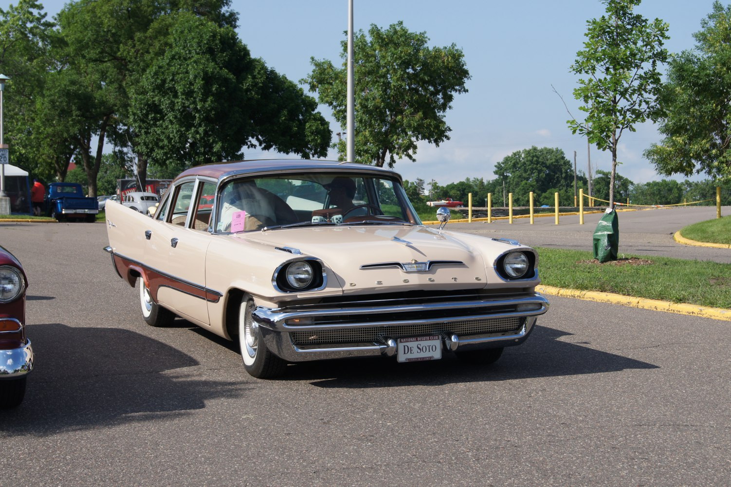 Front view of classic four-door sedan with distinctive headlights and chrome grille