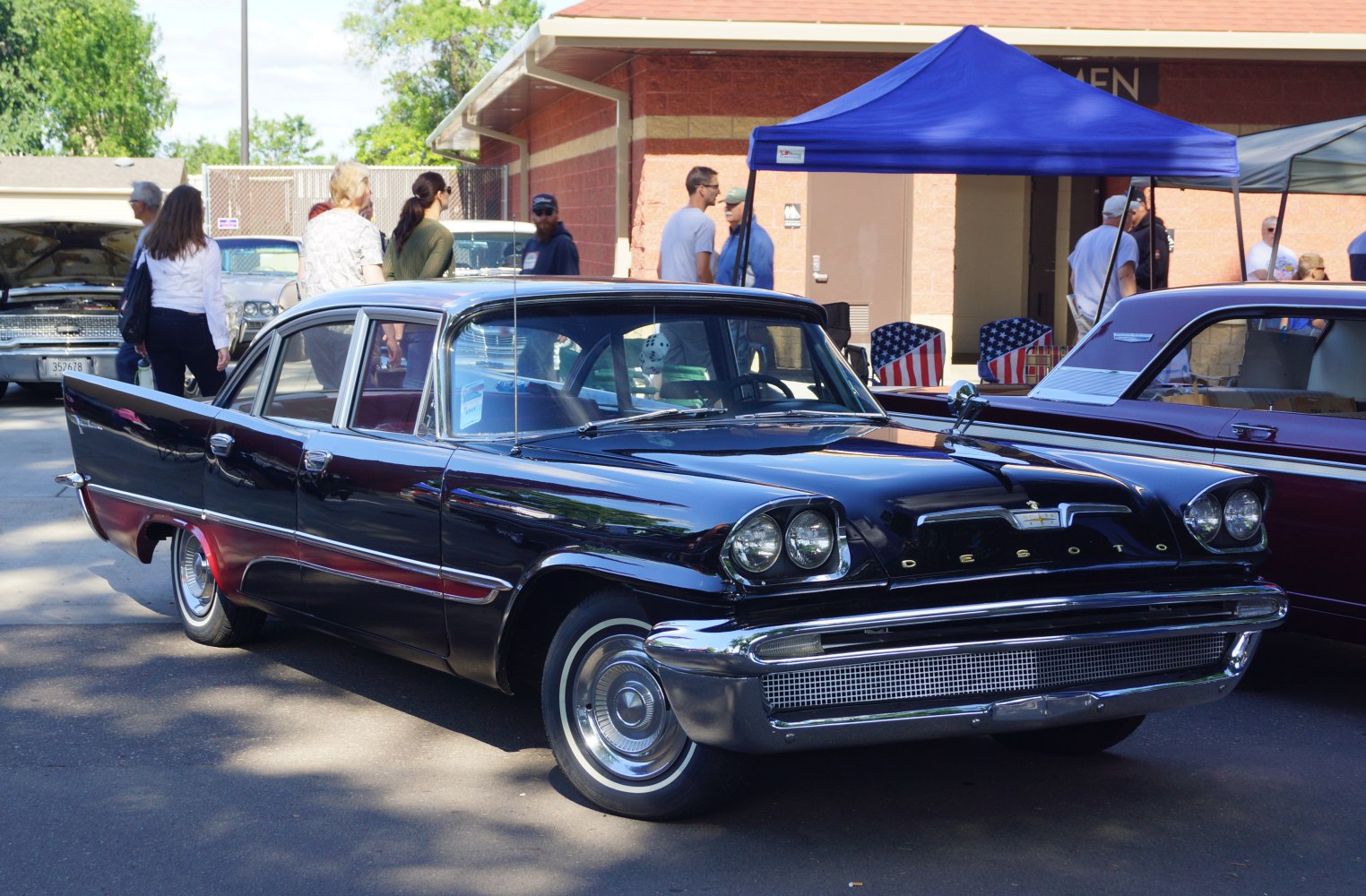 Classic four-door sedan with dual headlights and chrome grille