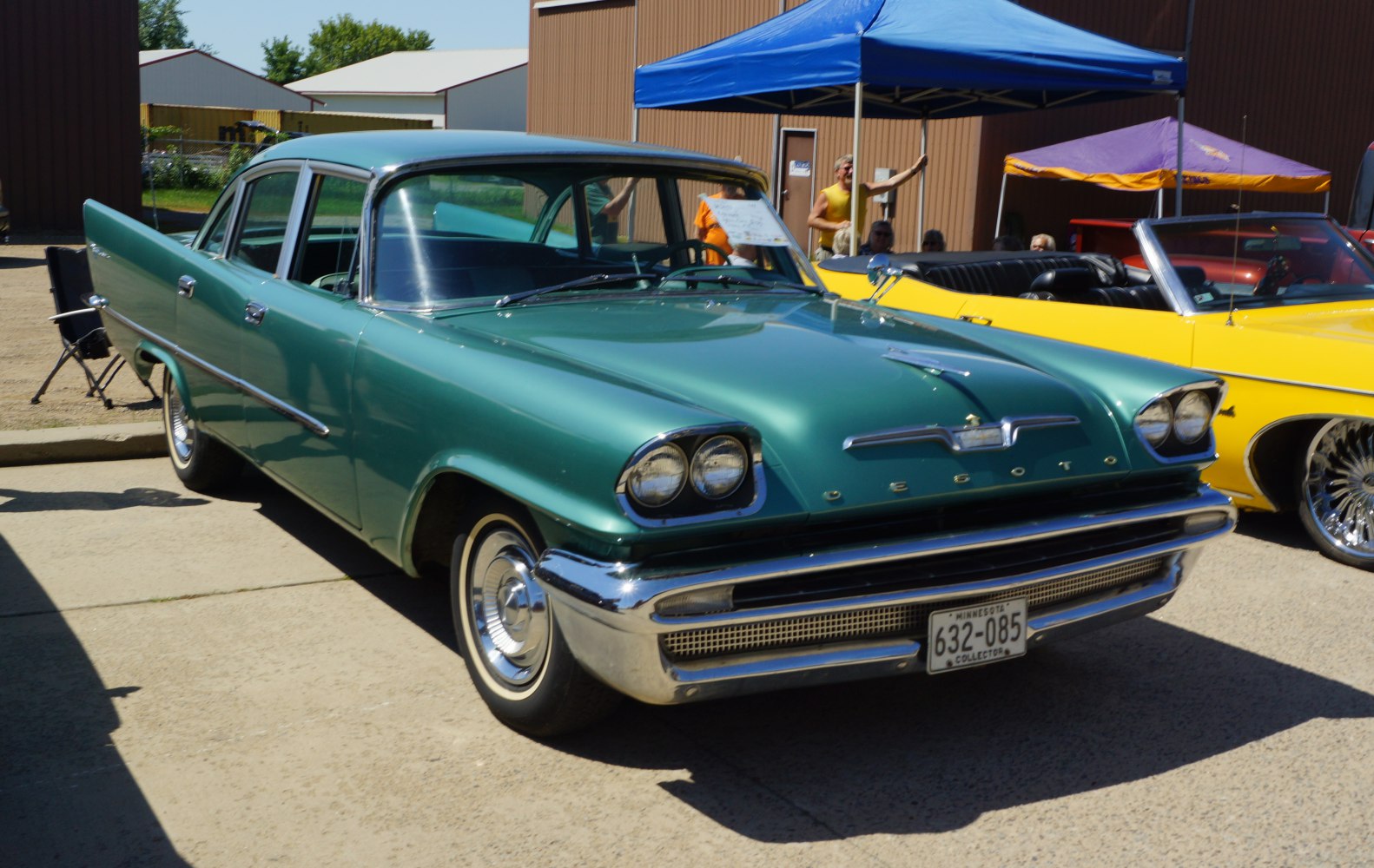 Dual round headlights and chrome accents on a vintage four-door sedan