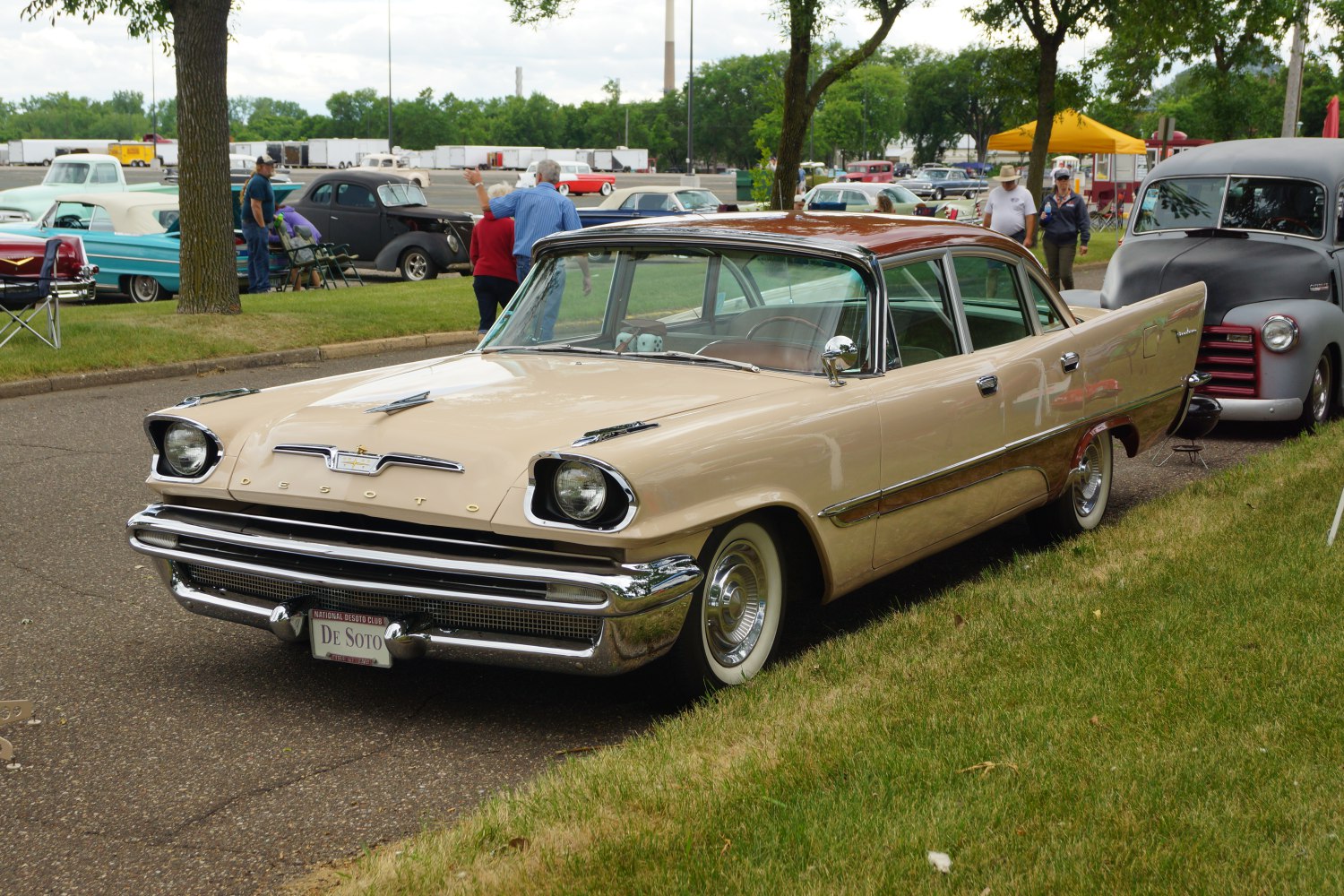 Vintage sedan with distinctive front headlights and rear tail fins