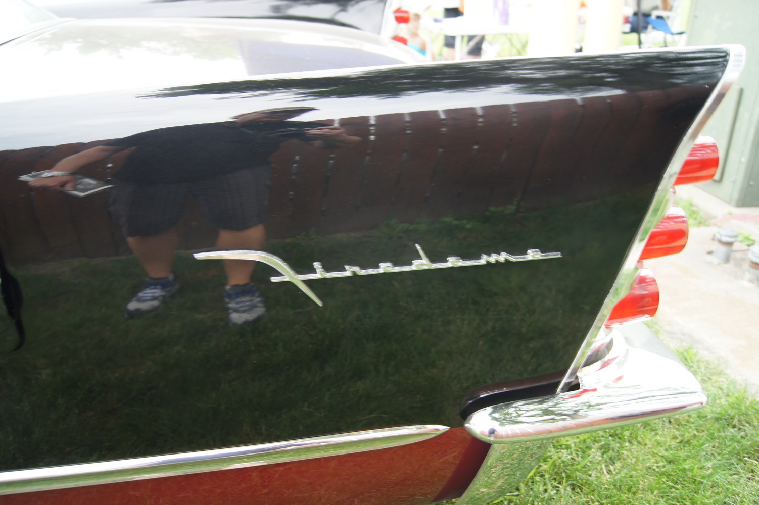 1950s car tailfin with Firedome emblem and triple vertical taillights