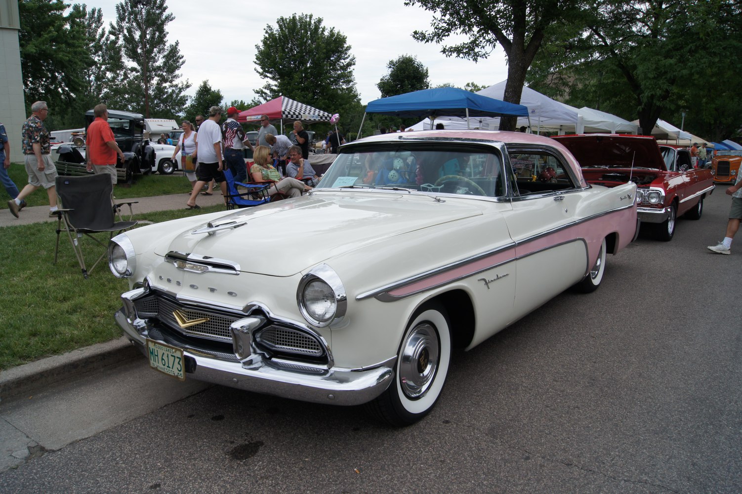 Classic two-tone vintage coupe with chrome grille and whitewall tires