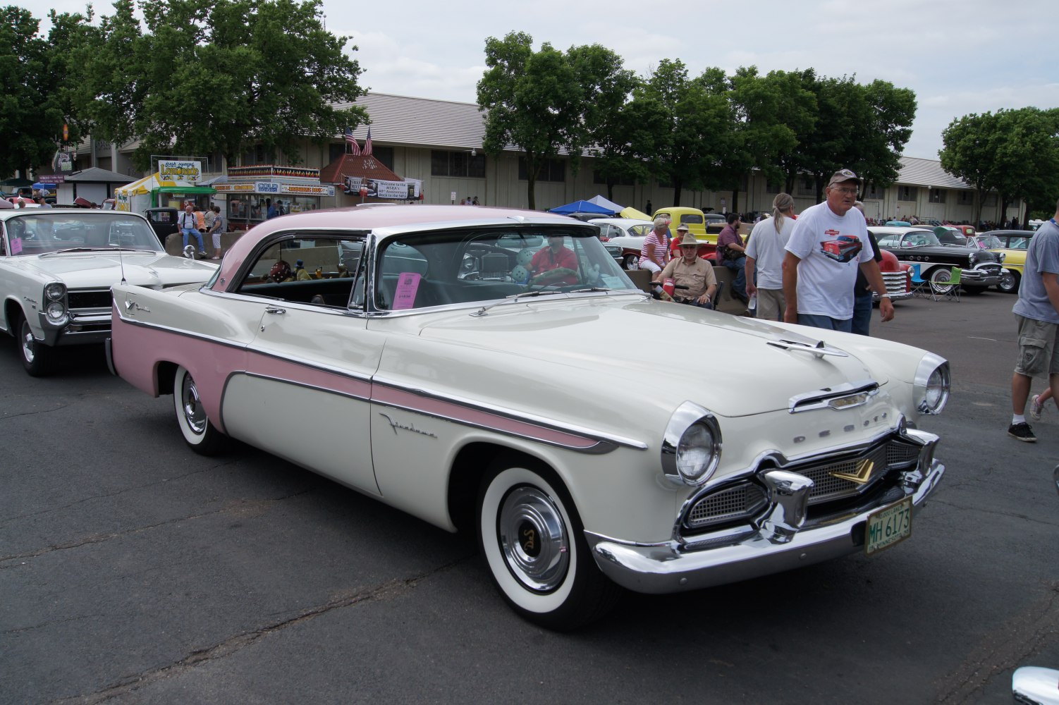 Vintage two-door hardtop with dual-tone paint and chrome grille