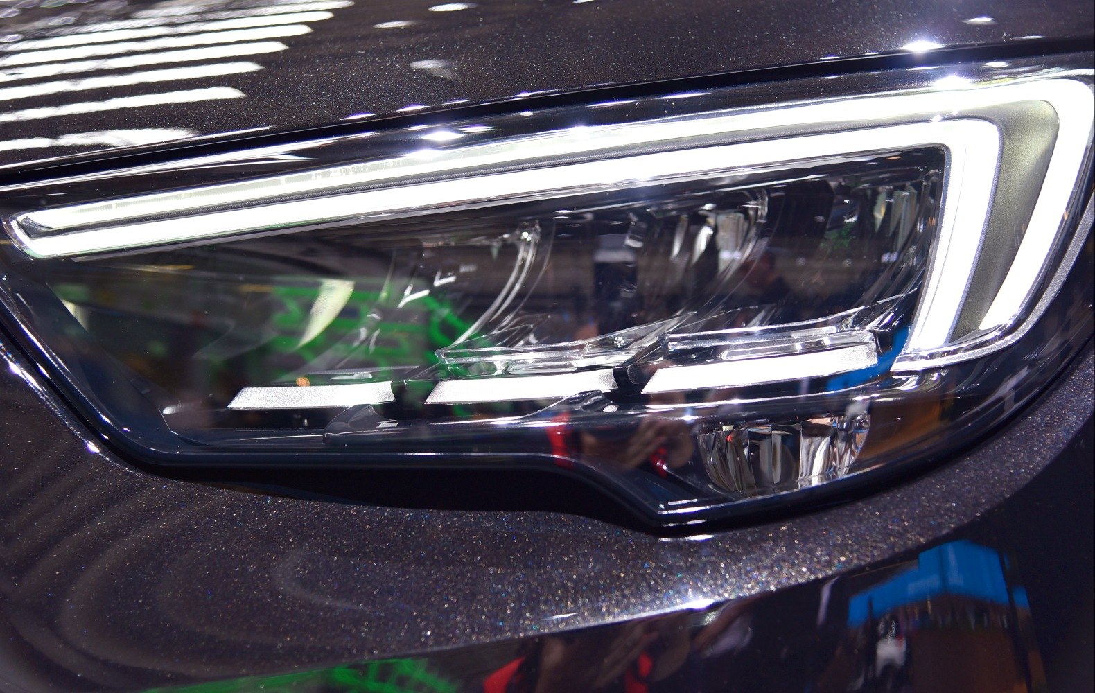Close-up of a modern LED headlight with sleek contours