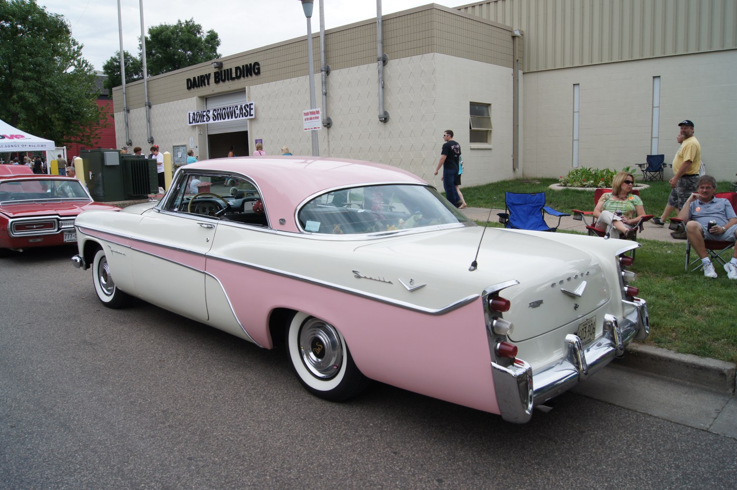 Vintage two-door coupe with distinctive tail fins and chrome accents