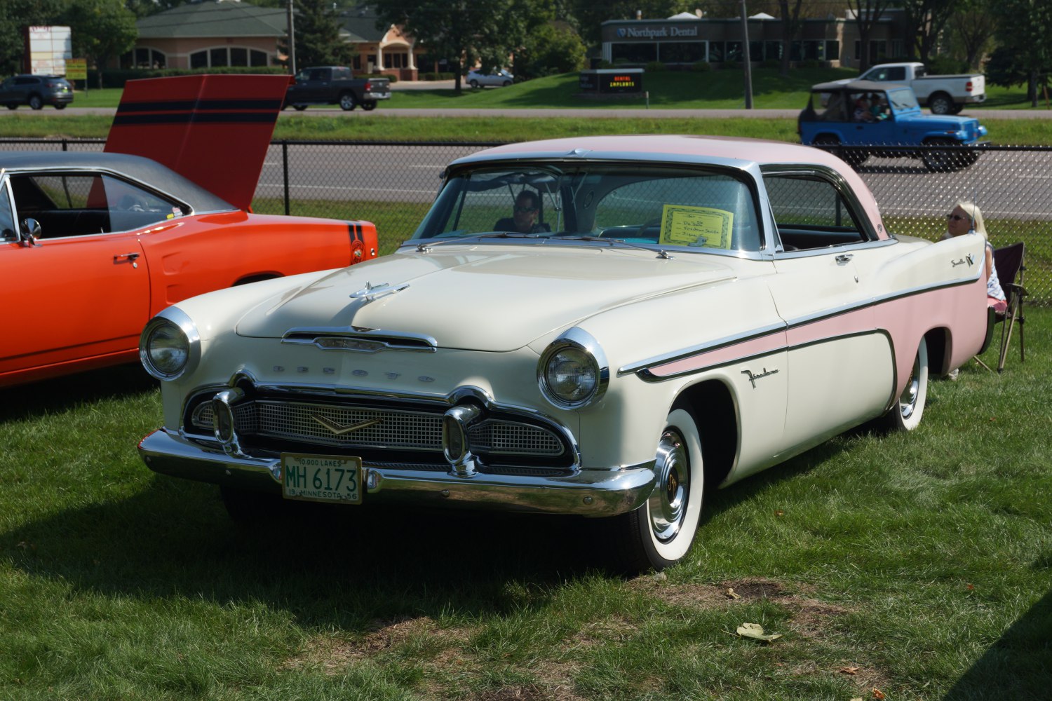 1950s two-tone vintage car with chrome grille and whitewall tires