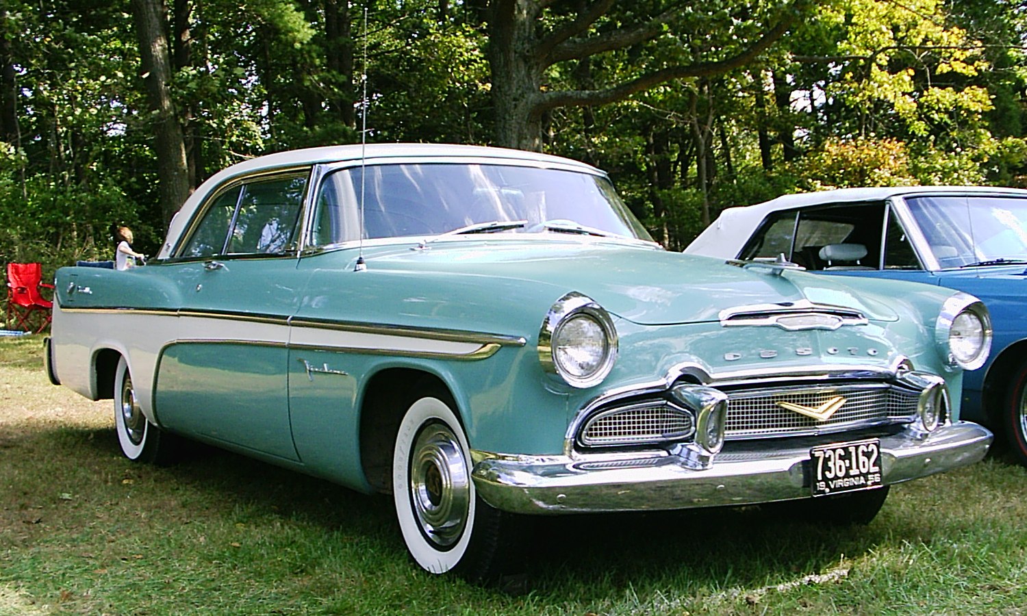 Classic front view with chrome grille and whitewall tires