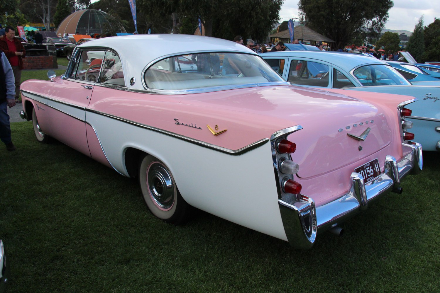 Rear view with two-tone pink-white paint and triple stacked tail fins